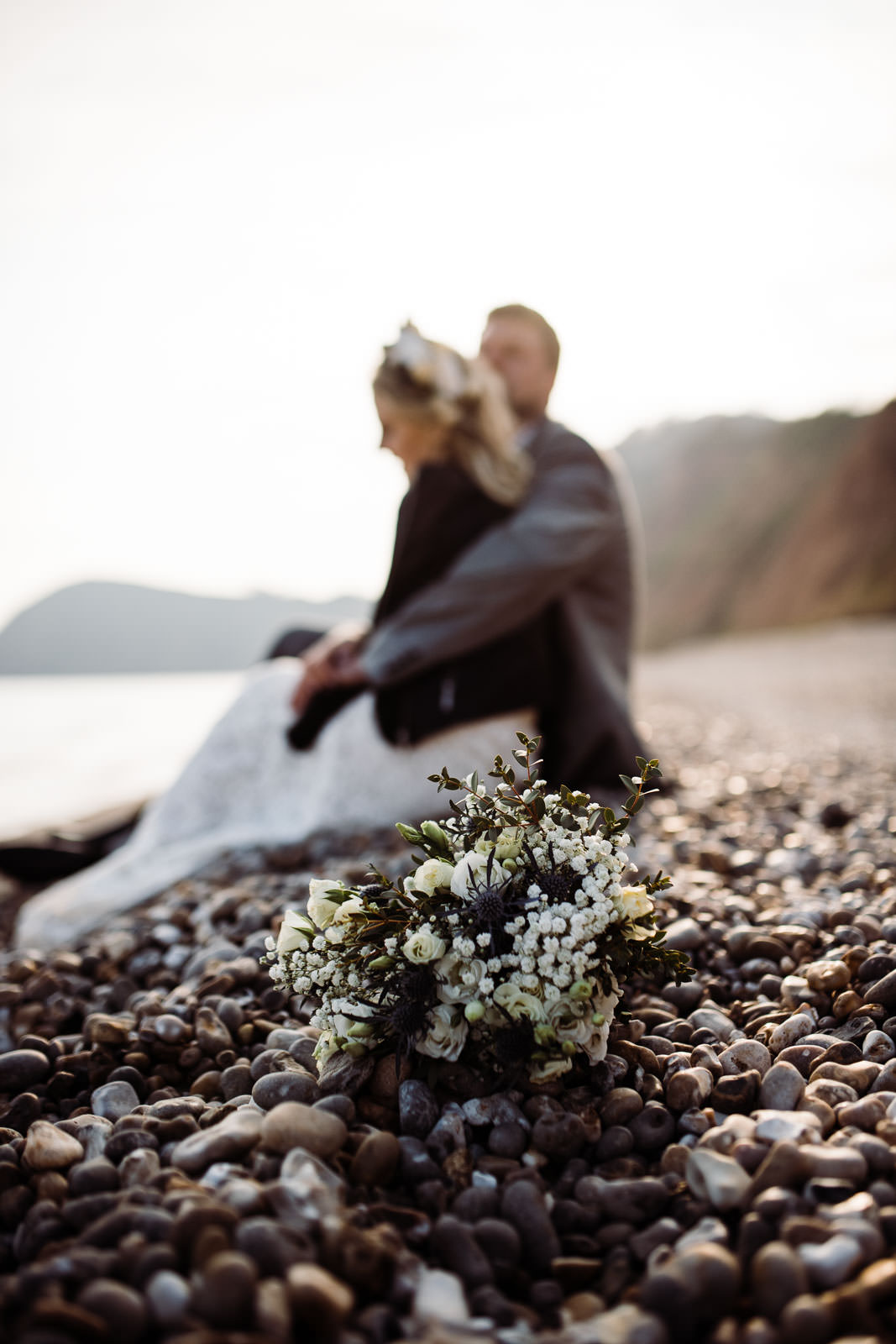 wedding flowers on beach in sunlight