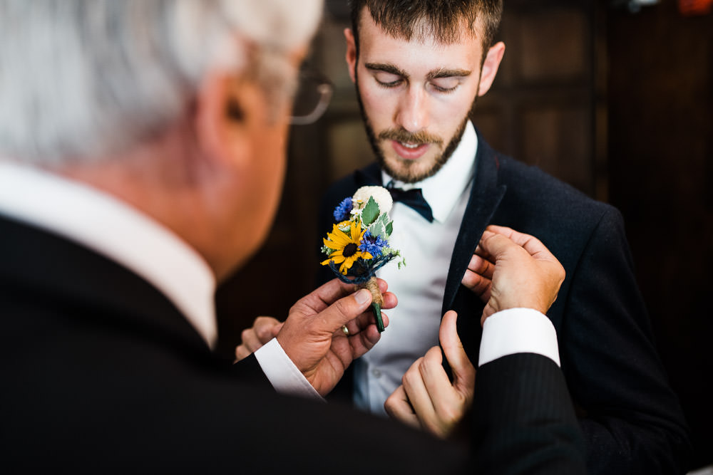 groom and his father getting ready before a wedding