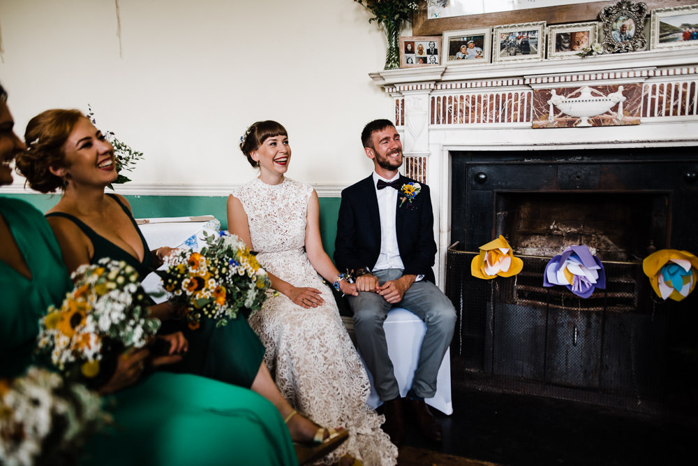 bride and groom sat near fire place