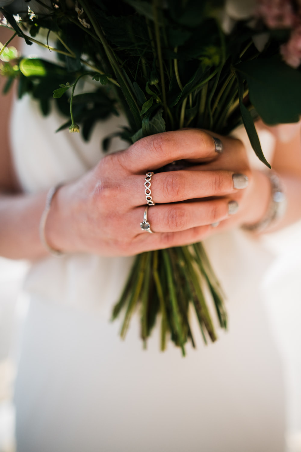 wedding bouquet and engagement ring