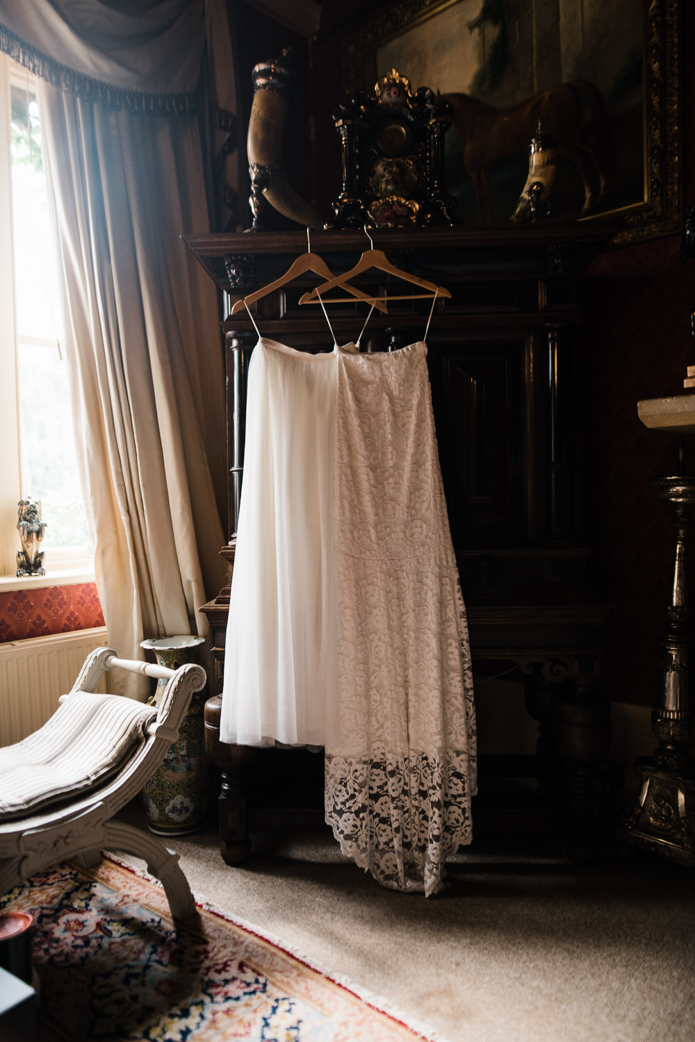 wedding dress hanging on wardrobe