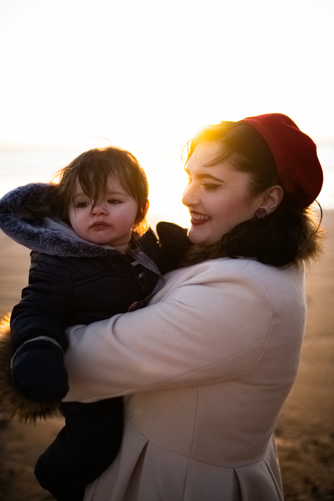 mum and little boy on sunset beach