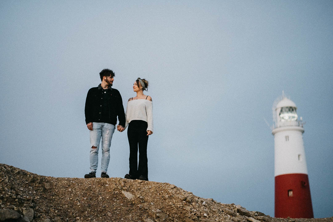 man and woman stood near lighthouse
