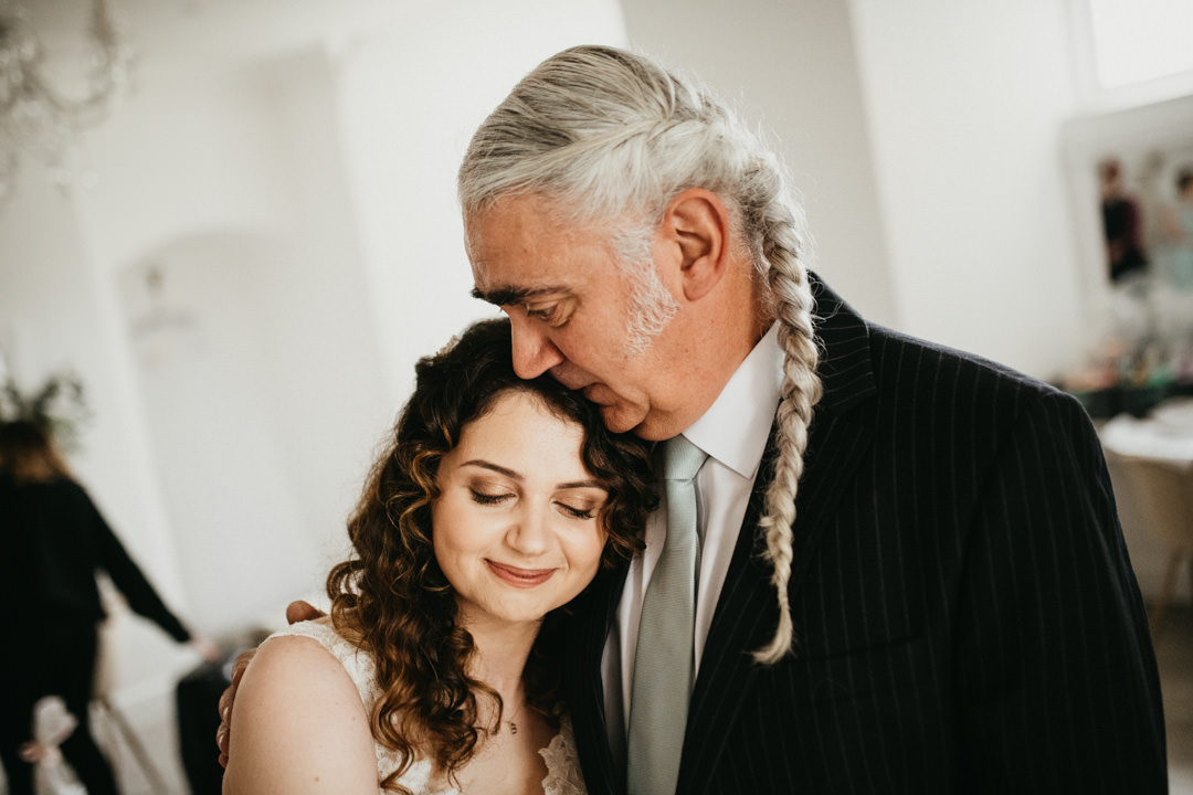 bride and father embracing