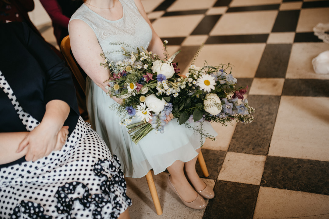 bridesmaid holding flowers
