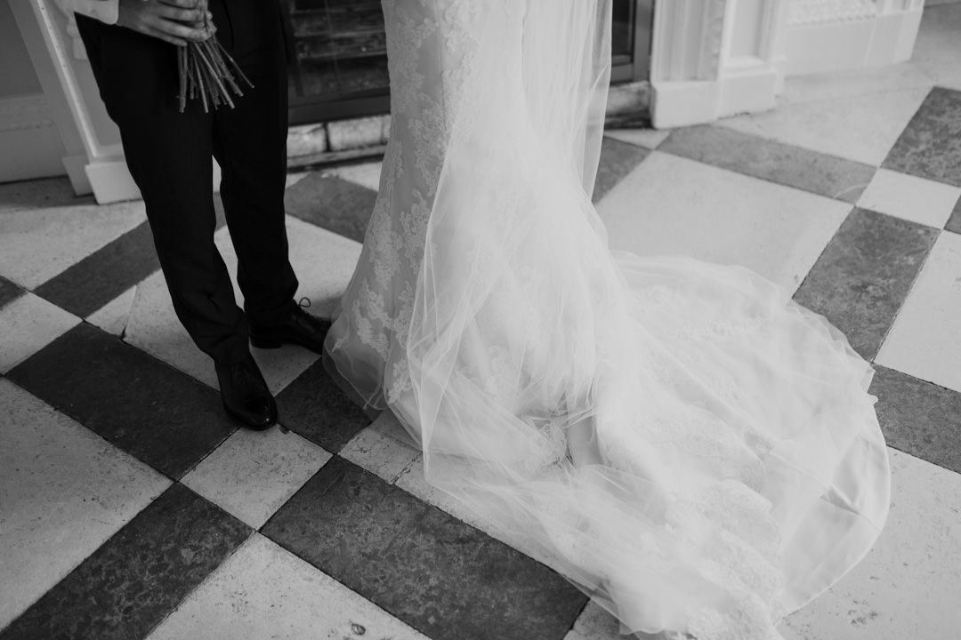 long white wedding dress on floor