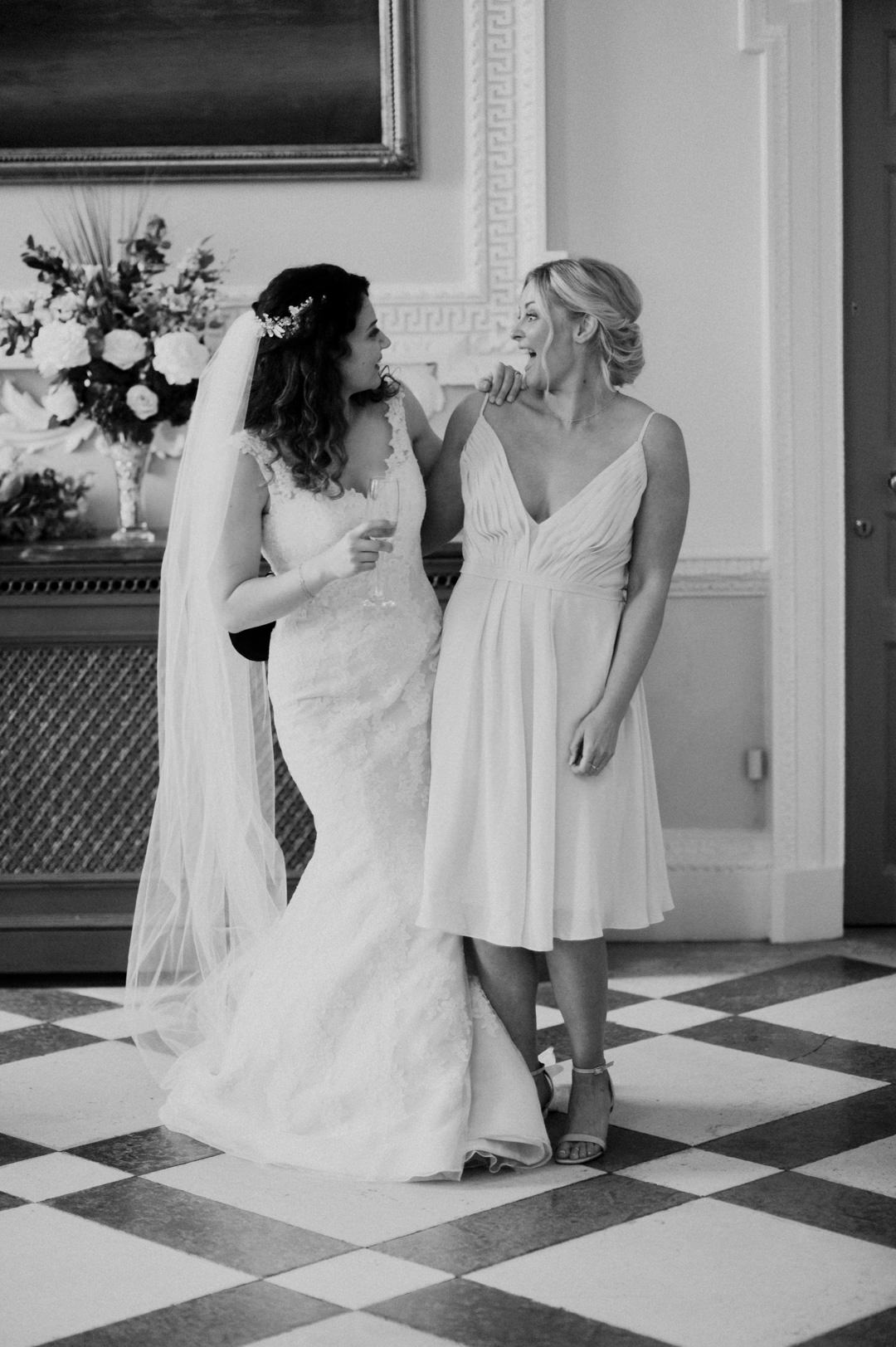 bride and maid of honour laughing and smiling
