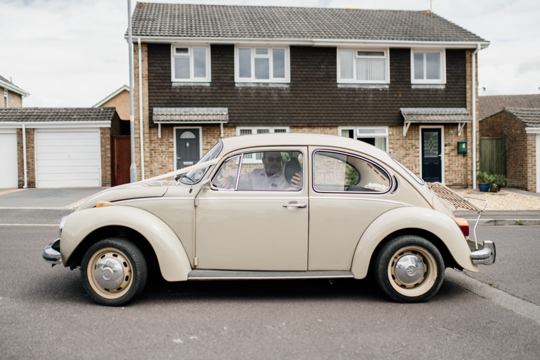 old beetle car outside house during day time
