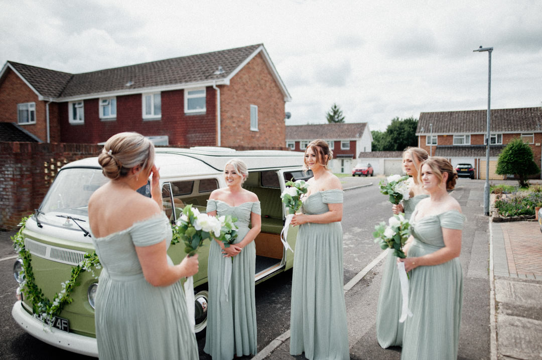 bridesmaids in green dresses in camper van