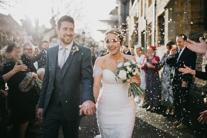 wedding confetti throw outside church during day time