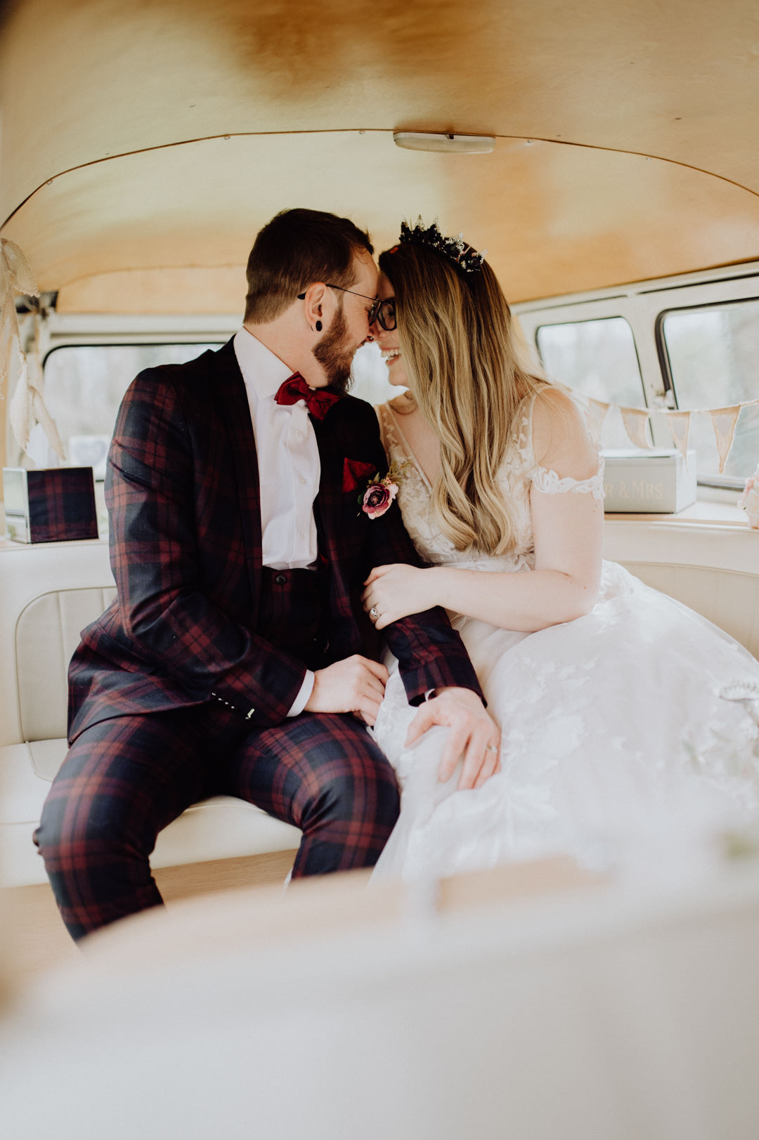 wedding couple kissing in classic car