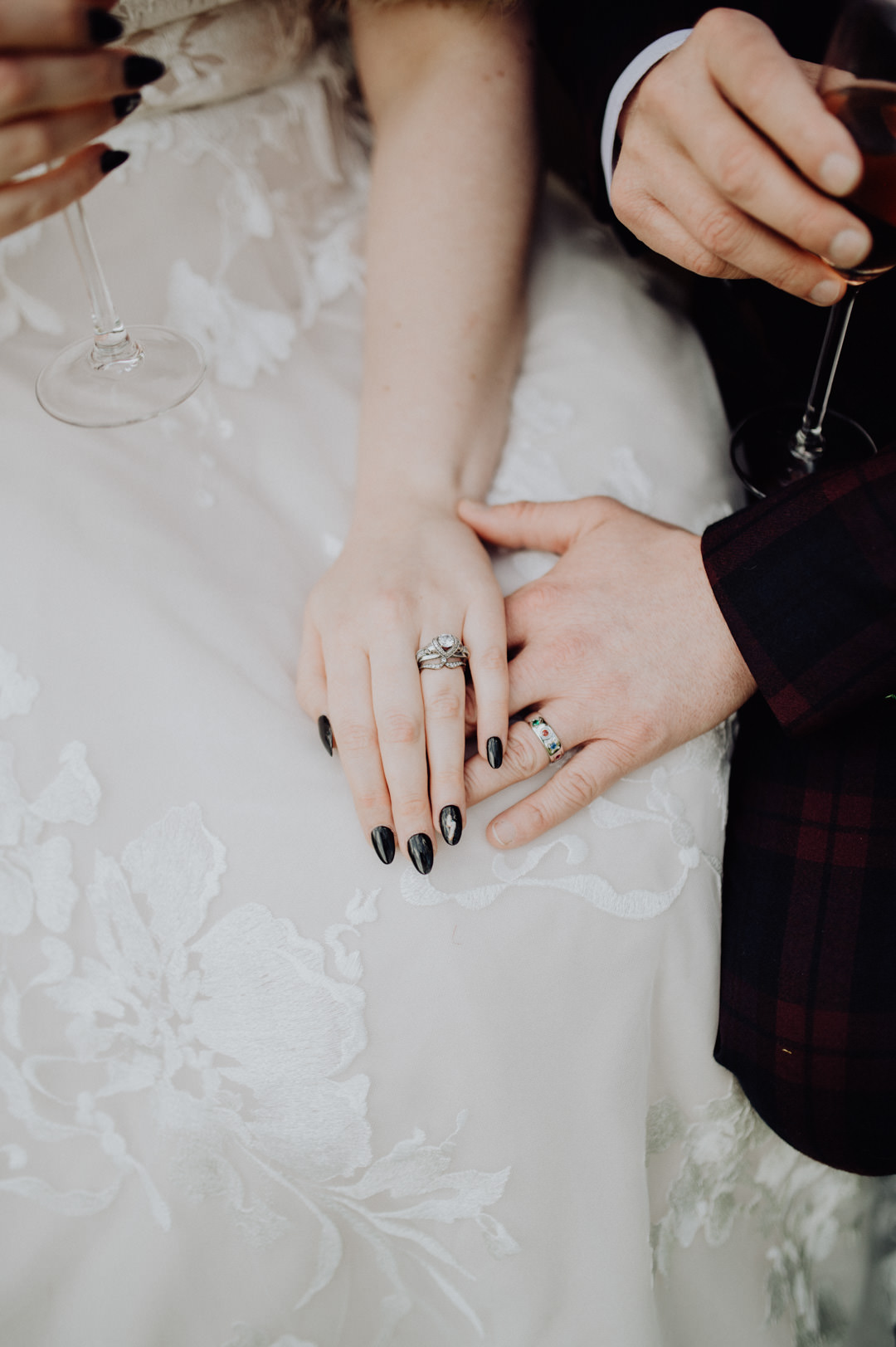 wedding rings on bride and grooms hands