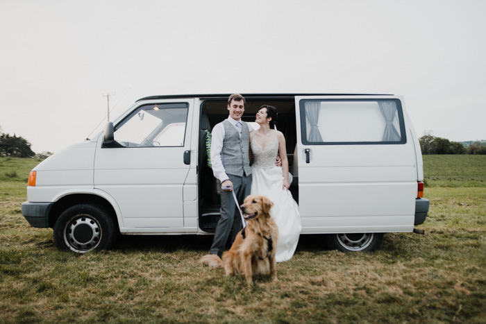 bride and groom in white camper van