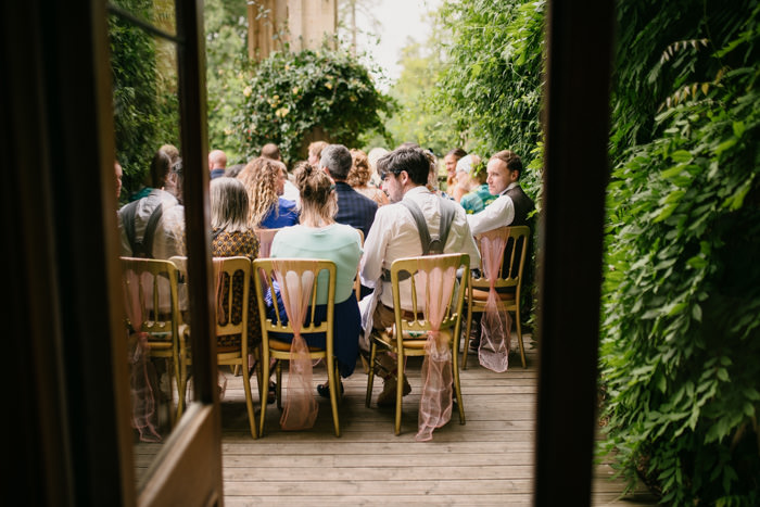 wedding guests sat in botanical garden