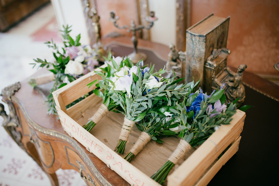 wedding flowers in wooden crate on table